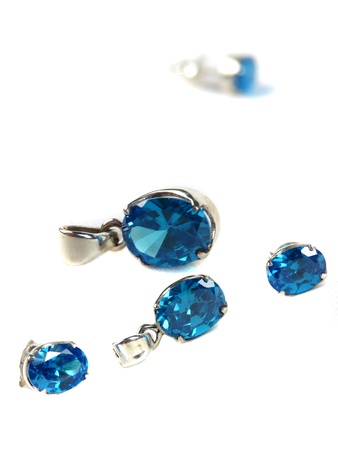 A set of silver jewelery with blue gemstones consisting of pendants and earrings                               の写真素材