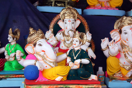 A rare idol of Lord Ganesh with his wife for sale on the festive ocassion of Ganesh Chaturthi in India.の写真素材