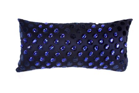 A luxurious black pillow studded with blue gemstones, on white studio background.の写真素材