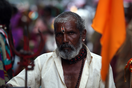 An Indian pilgrim carrying the trishul, who is a devotee of Lord Shiva.のeditorial素材
