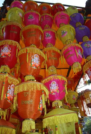 A tower of traditional lanterns for sale on festive occasion of Diwali in India.の写真素材