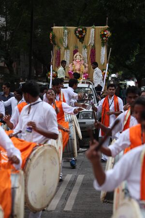 Pune, India - September 17, 2015: Ganesh festival procession being traditionally celebrated Dhol Tasha percussion and dancing.のeditorial素材
