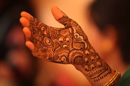 Beautiful design with traditional patterns of henna or mehendi as it is called on the hand of an Indian bride.の写真素材