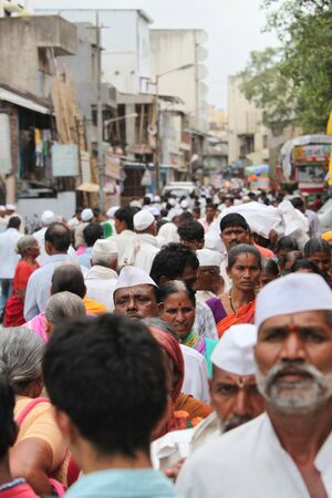 A crowded street in an Indian village during a hindu festivalのeditorial素材