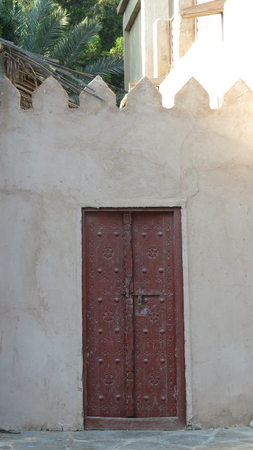 A traditional Arabian door with beautiful design on an old Arabic houseの写真素材