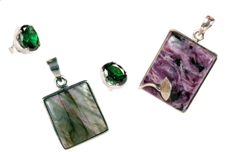 A set of pendants and rings made of silver and semi-precious stones of different colors.の写真素材