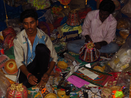 Indian craftsmen make traditional Diwali lanterns in their factory in India.のeditorial素材