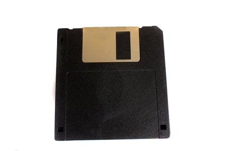 An old black floppy of 3.5 inch and storage of 1.44 MB used for storage.の写真素材