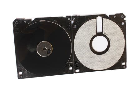 An old floppy used for storing data stripped down showing its magnetic disc.の写真素材