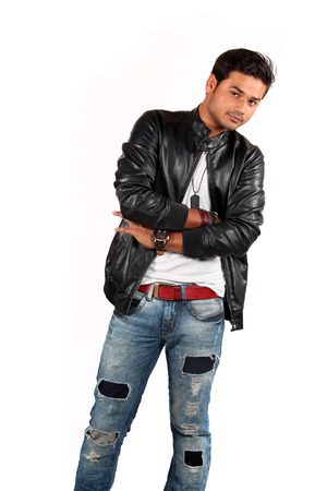 A handsome Indian teenage boy posing on a whit studio background.の写真素材