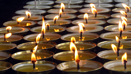 Holy Butter lit inside a Buddhist temple for prayers, similar are also used in Diwali festival for decoration.の写真素材