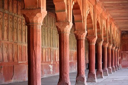 The pillars and arches in an ancient fort in the design of the traditional Islamic architecture.の写真素材