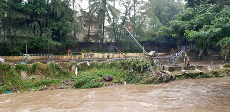 A childrens park destroyed near a river during floods in India during the monsoons.の写真素材
