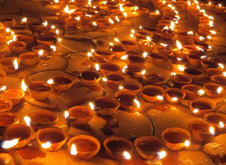 Traditional earthen lamps set on the floor for Diwali festival in India.                               の写真素材
