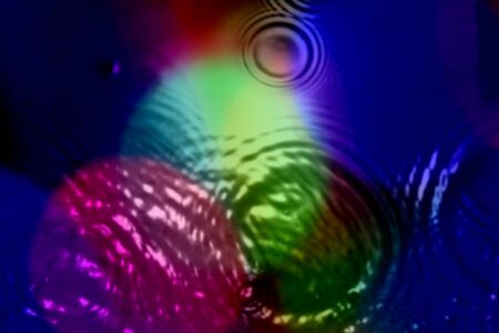 An abstract background of ripples in different patterns of psychedelic colors.の写真素材