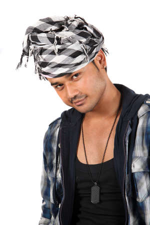 A handsome young Indian guy with a style, on white studio background.の写真素材