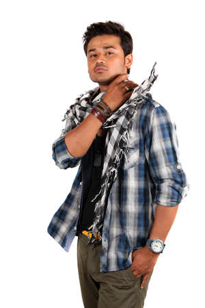 A young Indian model wearing his muffler in style, on white studio background.の写真素材