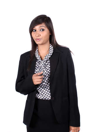 A young beautiful Indian businesswoman warning on whiteの写真素材