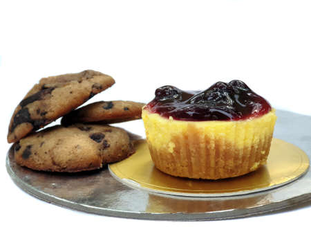 Delicious and scrumptious Chocolate chip cookies and cheesecake, on white studio background.の写真素材