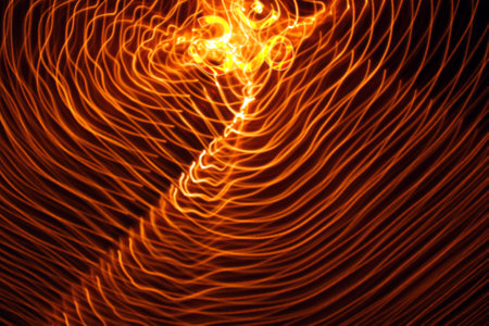 abstract fire background with smooth lines and bokeh lights.