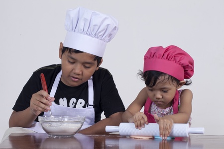 boy and girl cookingの写真素材