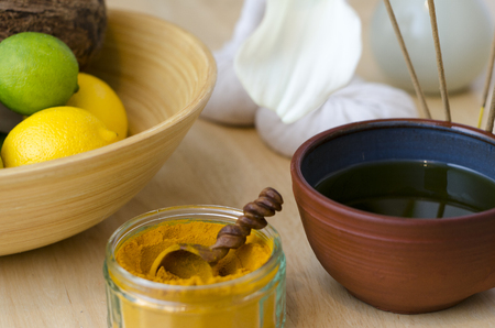 A table top arrangement of spice, oil and massaging tools, used in Ayurveda massage.の写真素材