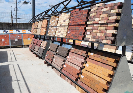 KYIV - UKRAINE, January - 11, 2017:  Stacks of various bricks, pavement blocks for sale. Building and construction materials, colored bricks, concrete pavers organized on pallets for saleのeditorial素材
