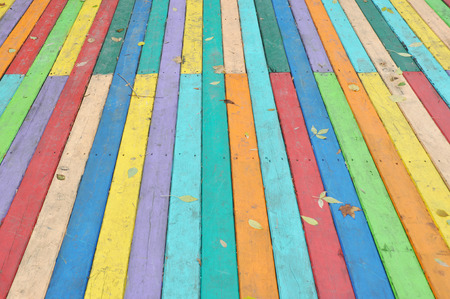 Wooden colorful floor with fallen leaves textured background.の写真素材
