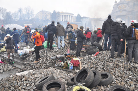 KYIV, UKRAINE - February 19, 2019: Protester burn tires and molotov coctails on the Maidan barricades to stop the riot police. Street fights in Kyiv, Ukraine. Ukraine crisis.のeditorial素材