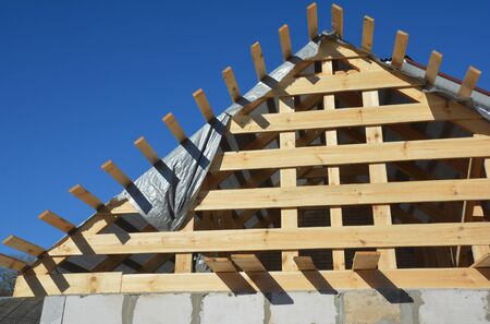 Roofing construction house with wooden beams, trusses, timber - front view.の写真素材