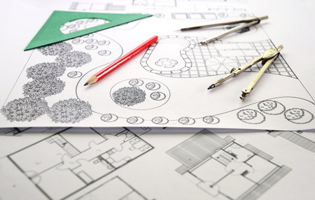 KYIV, UKRAINE - December, 20, 2019:  Landscape design and house apartment plan. Photo of landscape architect design garden plan with compass and pencil.  Plan of Landscape and Garden.のeditorial素材