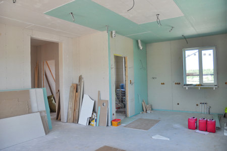 KYIV, UKRAINE - February, 17, 2020: Drywall house wall construction with painting, plastering walls. House remodeling, renovation, painting, extension and reconstruction with plasterboard.のeditorial素材