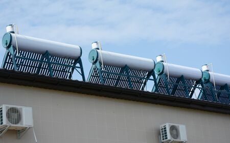 A close up on solar water heaters, stainless steel tank solar water heating system installed on the...