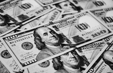 One hundred dollar bills of the USA currency money background as a concept of wealth, investment, passive income, cash flow, safe haven hard currency, banking system.の写真素材
