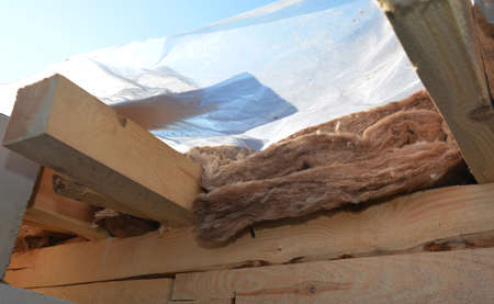 Roofing construction and insulation. Covering unfinished roofing construction insulated with mineral...