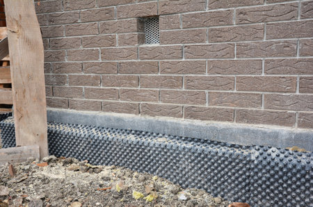 House basemet ventilation hole with foundation wall waterproofing and insulation.の写真素材