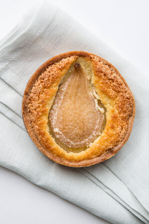 Pear tart on fold napkin の写真素材