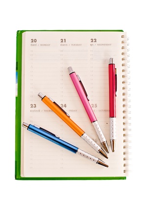 notebook and pen on white background の写真素材