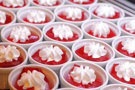 sweet cold red jelly and whipped creamの写真素材