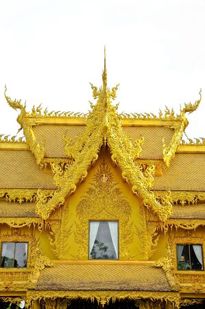 Font view of golden architectural at Wat Rong Khun, the famous Thai temple at Chiangrai province, Thailand.の写真素材