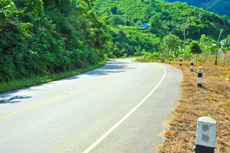 road in chiangsan, chiangrai thailand mountainsの写真素材