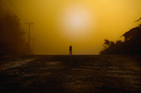 People take a photo on the road when sunsetの写真素材