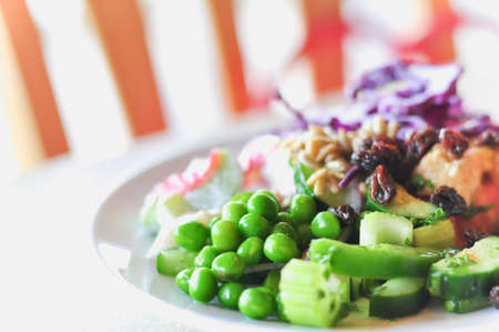 fresh vegetable salad on white disc, close-upの写真素材