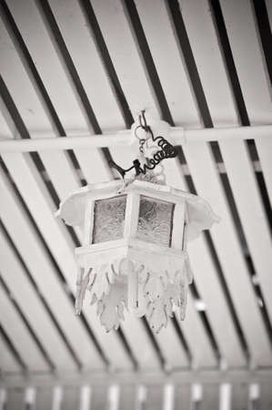 hanging white wood lamp on the ceilingの写真素材