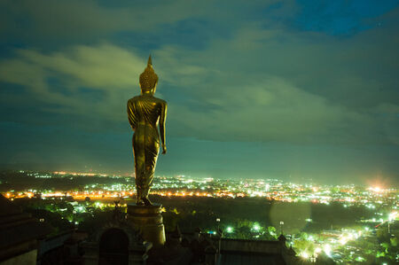 Buddha standing on a mountain Wat Phra That Khao Noi, Nanの写真素材