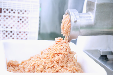 Mincer machine and fresh chopped meatの写真素材