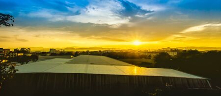 Sunset over the city chiang rai province thailandの写真素材