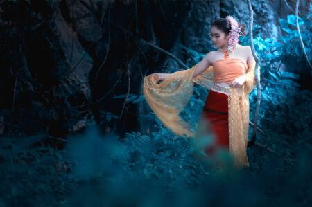 fine art portrait of thai woman wearing Thai dress in wildの写真素材