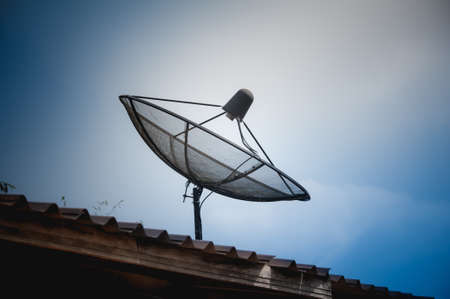 Big Black Satellite Dish on the roofの写真素材
