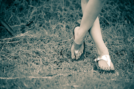 beautiful woman foot on grassの写真素材